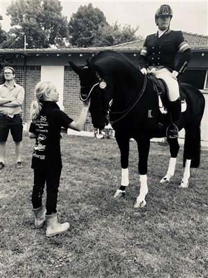 HOYS 2019 - waiting for prizgiving (second in the National Grand Prix Class) getting a pat from his future rider Jacinda's eldest daughter Claudia